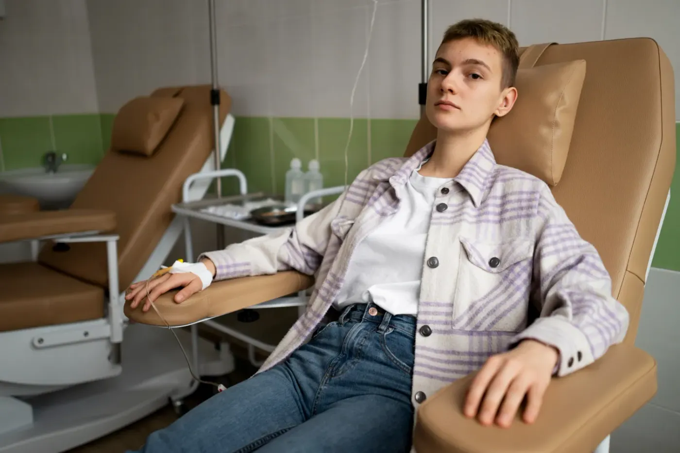 Therapist applying a blood flow restriction training cuff in Abilene, KS