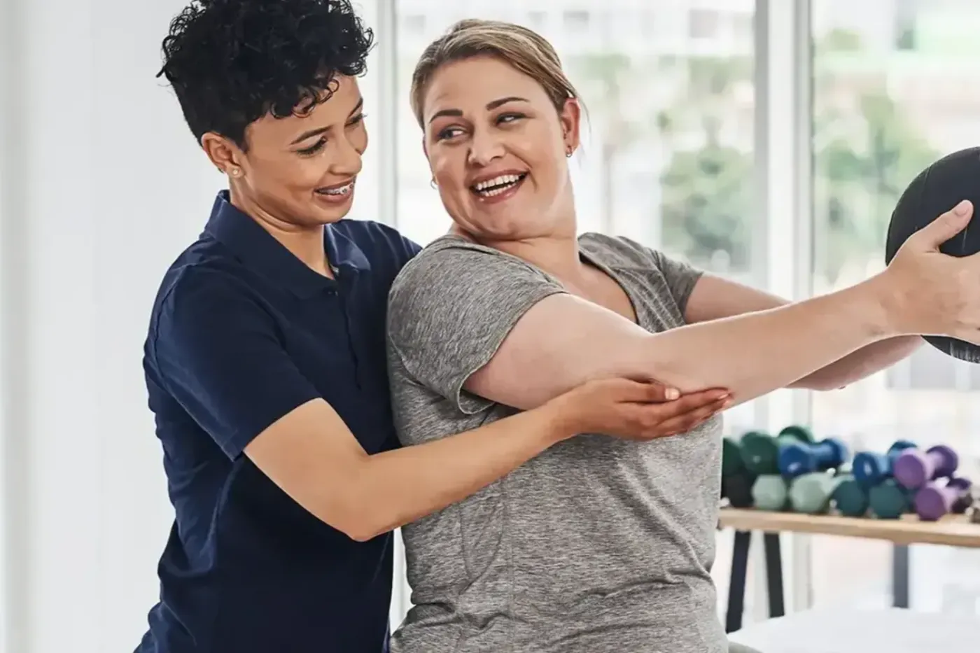licensed physical therapist working one on one with a patient