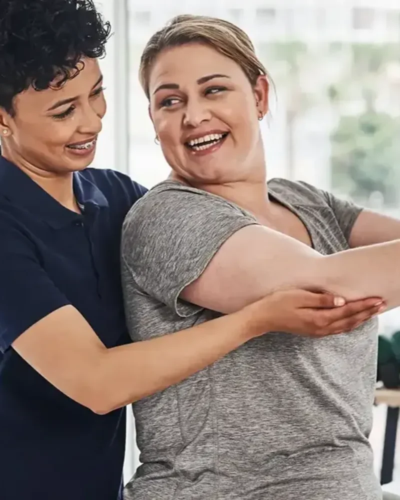 licensed physical therapist working one on one with a patient
