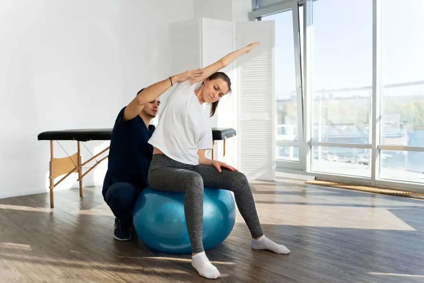 Therapist guiding a patient through balance rehabilitation exercises
