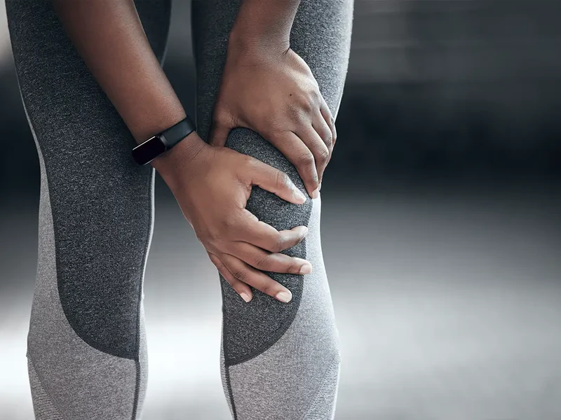 Physical therapist assessing hip and knee mechanics