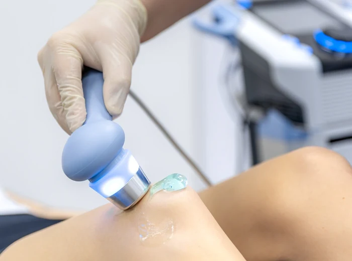 Therapeutic ultrasound applied to a patient's shoulder